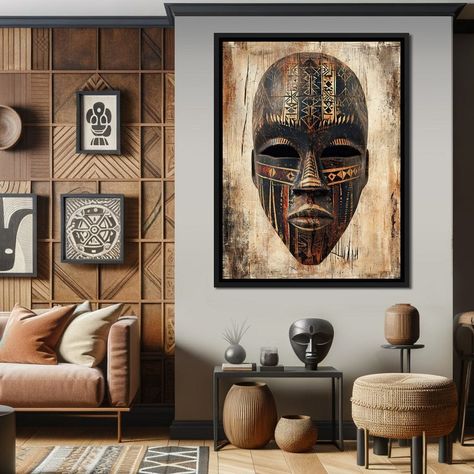 Immerse your space in the rich heritage of African culture with the Tribal Echoes of Ancestry Canvas Print. This powerful artwork elevates any room, infusing it with the wisdom and mystique of ancestral tales. Embrace the spiritual connection to history through this striking brown and wood-toned piece. Experience a daily reminder of your roots, or simply admire the tribal mask motif that transforms your wall into a testament to timeless beauty. African Artifacts Decor, Modern African Design, African Style Living Room, Afro Boho Living Room, Afro Bohemian Style Decor, Open Kitchen Partition Ideas, Kitchen Partition Ideas, Afrohemian Decor, Listening Bar