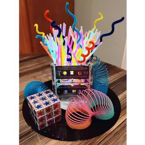 80s Party Centerpiece Ideas, Party Themes 80s, Diy 80s Decorations Party, Retro Party Centerpieces, 90's Theme Centerpieces Party Ideas, 80s Party Decorations Centerpieces, 70s Theme Centerpiece, 90s Party Centerpieces, 80s Theme Party Centerpieces