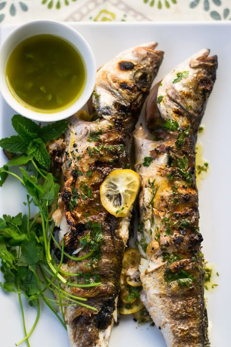 Grilling Seafood, Branzino Recipe, Grilling Fish, Whole Fish Recipes, Fish Steak, Herb Oil, Lemon Slices, Grilled Fish, Seafood Dinner