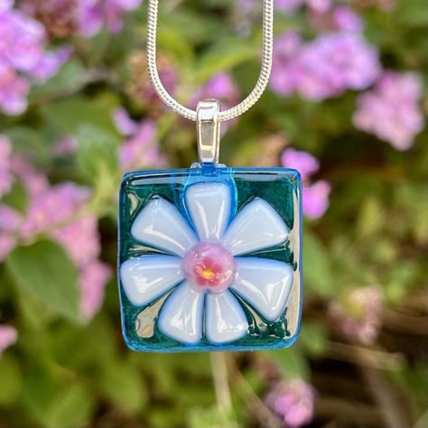 "Fused Glass Flower Necklace in assorted beautiful colors!  Please choose your transparent background in blue, turquoise, aquamarine, or lavender. The petals in white or pink/white, and your special millefiori center in blue, pink, or yellow (see 2nd pic for some of the options).  This pendant was Contour fused for a beautiful texture. Each piece retains its individual character, while edges are soft and rounded.  The pendant is mounted on silver plated leaf bail and comes with an 18\" silver pl Fuse Glass Jewelry, Fusible Glass Projects, Fused Glass Inspiration, Glass Fusion Jewelry Ideas, Fused Glass Jewelry Ideas, Fused Glass Pendants Ideas, Small Fused Glass Ideas, Glass Fusing Jewelry, Fused Glass Magnets