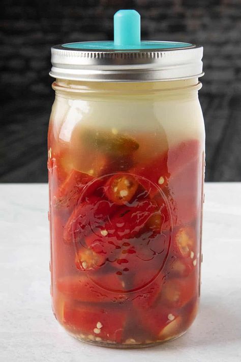 Fermented Hot Sauce Recipe - I grew loads of peppers in my garden this year just so I could make this fermented hot sauce recipe. It is wonderfully spicy and big on flavor. Drizzle it over anything. Works for any type of peppers. #HotSauce #Serranos #SpicyFood Fermenting Peppers For Hot Sauce, Fermented Serrano Hot Sauce, Fermented Cayenne Peppers, Fermented Ghost Pepper Hot Sauce Recipe, Homemade Tabasco Sauce, Fermented Cayenne Pepper Sauce, Trinidad Scorpion Pepper Hot Sauce, Fermented Hot Peppers, Fermented Tabasco Sauce