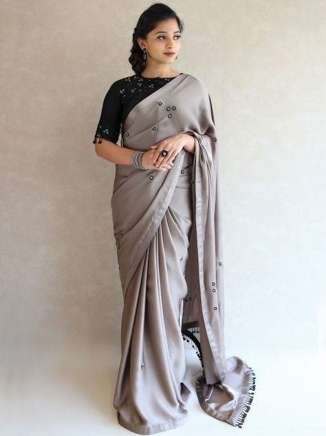 Pastel shade simple shimmer designer saree with black High neck blouse Saree Blouse Styles, Cotton Saree Blouse Designs, Sarees For Girls, Grey Saree, Indian Saree Blouses Designs, Half Saree Designs, Indian Fashion Saree, Unique Blouse Designs, Designer Saree Blouse Patterns