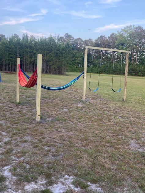 Hammock poles set 10ft apart and 6 ft high. Hammock hooks at 5ft Swing set is 8 ft high by 8 ft tall. All poles set in concrete 2 ft Hammock Hooks, Diy Hammock, Play Structures, Backyard Dreams, Play Structure, Backyard Play, Fire Pit Patio, Dream Backyard, Swing Set