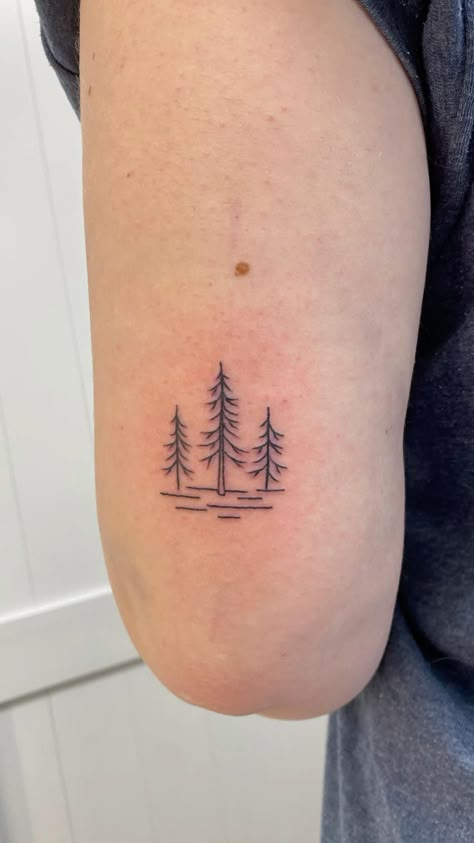 Small Forrest Tattoo Design, Pnw Small Tattoo, Dainty Tree Tattoos For Women, Minimalist Hunting Tattoo, Small Canoe Tattoo, Mini Pine Tree Tattoo, Georgia Pine Tree Tattoo, Small Tree Tattoo Ideas, Single Line Pine Tree Tattoo