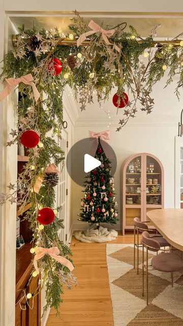 Emily Welch | Cozy Home & Life on Instagram: "Have you tried this hack??  I found my realistic garlands, star garlands, bows, ornaments, oversized pink bow, lights and tree at @michaelsstores! Also how cute are these nutcrackers?? #ad   This hack is perfect for tricky doorways or when you don’t want to ruin your wall!   Comment “Link” for links dmd!   #everythingtocreateanything #michaels #christmasdecor #garlandhack #whimsicaldecor cozy home, cozy Christmas, DIY Christmas decor https://liketk.it/4Wc8Y" Hallway Decorating Christmas, Doorway Christmas Decor, Garland Over Doorway, Nutcracker Decorations Ideas, Christmas Garland Doorway, Doorway Garland, Bow Lights, Christmas Doorway Decorations, Nutcracker Tree