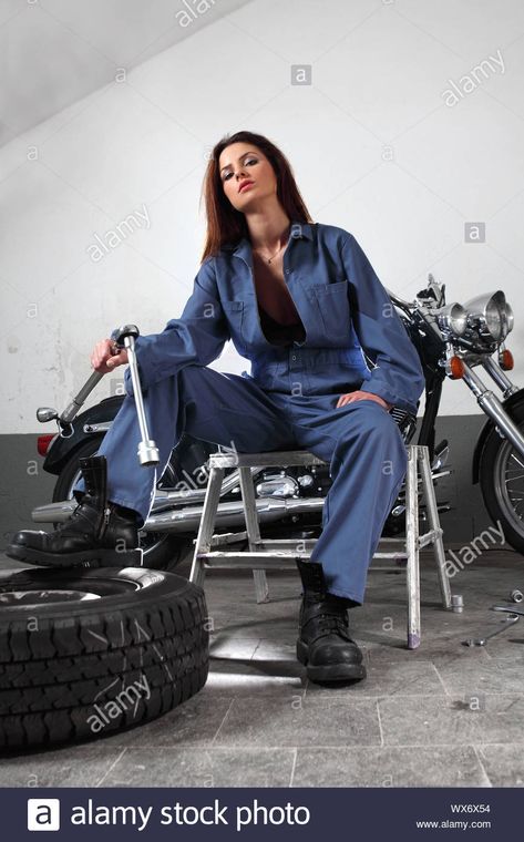 Download this stock image: Photo of a beautiful female mechanic working on a motorcycle wearing overalls and holding a large ratchet. - WX6X54 from Alamy's library of millions of high resolution stock photos, illustrations and vectors. Mechanic Outfit, Mechanics Photography, Mechanic Costume, Female Mechanic, Mechanic Overalls, Mechanics Aesthetic, Mechanic Clothes, Wearing Overalls, Woman Mechanic