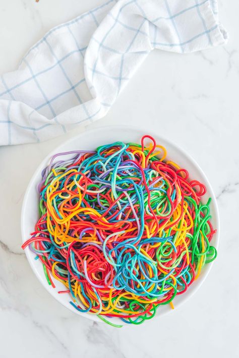 Rainbow Spaghetti on a white table Rainbow Spaghetti, Baked Spaghetti Casserole, Spaghetti Casserole, Party Dishes, Baked Spaghetti, Pasta Dish, Family Meal, White Table, Fun Family