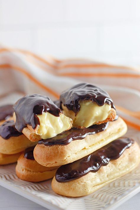 You’ll love these homemade Chocolate Eclairs! Featuring light and airy choux pastry filled with creamy vanilla custard and topped with rich chocolate ganache, these eclairs are a timeless treat. Perfect for special occasions, afternoon tea, or a luxurious dessert. Luxury Desserts, Vanilla Custard Recipe, Chocolate Eclairs, Chocolate Eclair, Custard Recipes, Choux Pastry, Special Desserts, Vanilla Custard, Chocolate Icing