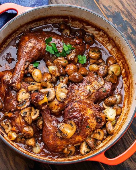 Coq au Vin is a rich and hearty French stew of chicken that's braised until tender in red wine with vegetables and herbs, then finished with mushrooms and pearl onions sauteed in butter. Coq au Vin is perfect served with crusty bread or with mashed potatoes. #coqauvin #frenchcuisine #stewrecipes #chickenrecipes Coque Au Vin Recipe, Chicken Provencal Recipes, Cog Au Vin, French Stew, Braised Potatoes, Dumplin Recipe, Coq Au Vin Recipe, Sip And Feast, Weekend Recipe