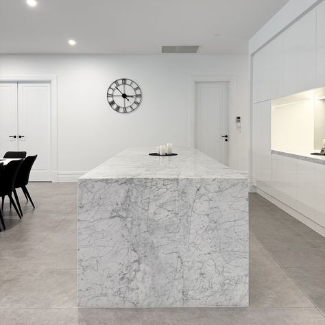 Bianco Carrara Marble Kitchen | Uniq Stone Deluxe Natural Stone The mitred waterfall ends, vein matched front panel on the island, and side panels make it a real standout. This Italian marble adds a touch of class, making it the perfect centrepiece for your home. Want to bring this natural beauty into your kitchen? Visit www.uniqstone.com.au #marble #adelaidemarble #marblekitchen #marblebenchtops #marbledesign #stonemason #benchtopsadelaide #stonebenchtops #adelaidehomes #interiodesign #kit... Bianco Carrara Marble Kitchen, Carrara Marble Kitchen, Stone Bench, Italian Marble, Kitchen Marble, Carrara Marble, Marble Design, Panel Siding, Marble