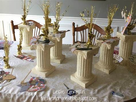 greek columns centerpiece decorations Goddess Party Theme, Santorini Wallpaper, Greek Party Decorations, Greek Wedding Theme, Greek Party Theme, Bat Mitzvah Centerpieces, Greece Party, Bar Mitzvah Centerpieces, Mitzvah Centerpieces