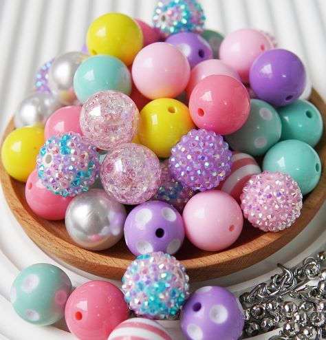 PRICES MAY VARY. Versatile: These 20mm Bubblegum Beads come in enough styles and colors to be used for a variety of creative projects, including making beadable pens, jewelry, keychains, and other decorative items. Colorful: Like bubble gum beads, our chunky beads are brightly colored and visually appealing. Using our bubble beads to make some colorful and eye-catching accessories can be a draw for attention and for customers if you're making re-sell crafts. Unique Texture: The chunky texture of Bubble Gum Beads Keychain, Cheap Colorful Large Beads, Bubblegum Bead Necklaces, Bubblegum Bead Pens, Bead Pens, Bubble Beads, Crafts Unique, Bubblegum Beads Wholesale, Pen Making