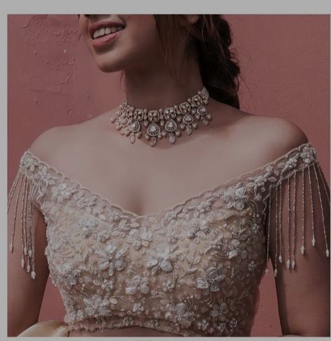 Lengha For Sangeet Indian Weddings, One Sleeve Blouse Design, Blouse Design For Net Lehenga, Off Shoulder Lengha Blouse, Sangeet Lehenga Blouse Design, Off Shoulder Dress Jewelry Ideas, Bridal Lengha Blouse Designs, Net Lehenga Blouse Designs, White Blouse Ideas