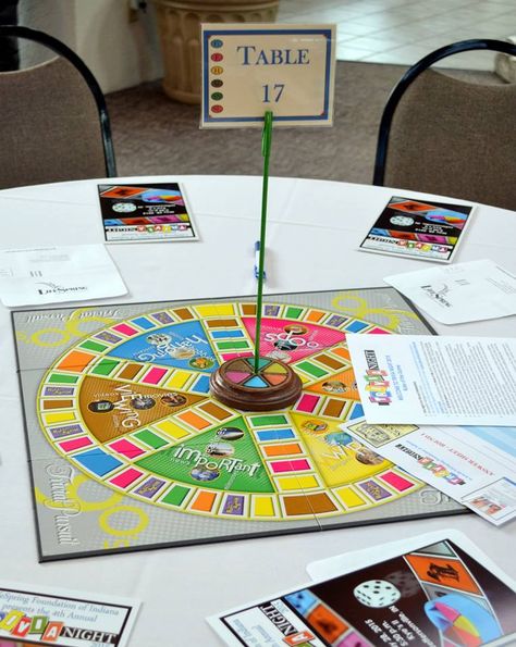 Centerpieces used for our LifeSpring Foundation of Indiana Trivia Night 2015. Game boards purchased online. Table numbers made with painted wooden pieces and printed game piece photos, painted dowel sticks, and laminated table numbers. Night Table Decor, Game Night Decorations, Board Game Themes, Night Decor, Game Night Parties, Military Decorations, Work Holiday Party, Board Game Night, Board Game Table