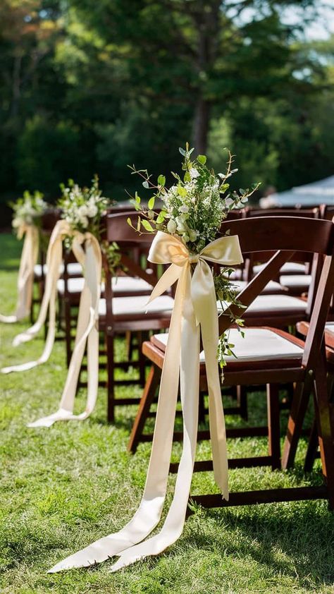 18 Wedding Aisle Decoration Ideas For Your Special Day Outdoor Christian Wedding Decor, Non Floral Ceremony Decor, Simple Ceremony Decor Indoor, Wedding Ceremony Bows On Chairs, Wedding Ceremony Chair Flowers, Aisle Decorations Wedding Simple, Bow Aisle Decor, Outside Ceremony Wedding, End Of Isle Decor