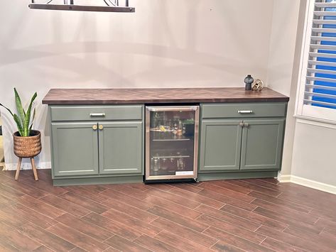 DIY dry bar with unfinished cabinets and a butcher block. Butcher Block Dry Bar, Wet Bar Ideas Butcher Block, Wet Bar Butcher Block Counter, Cheap Diy Dry Bar, Butcher Block Buffet Cabinet, Basement Bar Stock Cabinets, Butcher Block Bar, Diy Dry Bar, How To Make Pastry