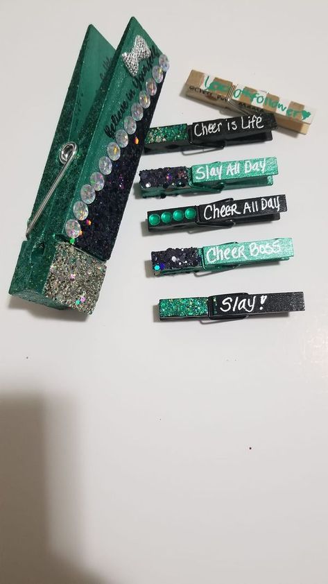 All About Cheer Pins | These 6" jumbo pins are so cool | Facebook Cheer Pins For Backpacks Diy, Cheer Pegs Ideas, Pins For Cheer Comps, Cheer Competition Clothespins, Cheer Competition Pins, Cheer Clip Ideas, Cheer Close Pin Ideas, Cheer Comp Pins, Kindness Clips