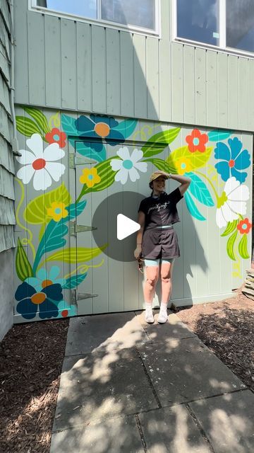 Jillian Goeler on Instagram: "Paint a mural with me!  I had the pleasure of painting some sweet florals on a residential shed this week 🥰 It was SWEATY but we persisted and the result is so cute!   This one’s a little different than my usual…no lettering and no stars!? ✨ who am I??" Wall Mural Design Ideas, Outdoor Floral Mural, Garden Murals Outdoor, Painted Shed Mural, Mural On Shed, Simple Flower Mural, Small Mural Ideas, Shed Murals Outdoor, Door Paint Design