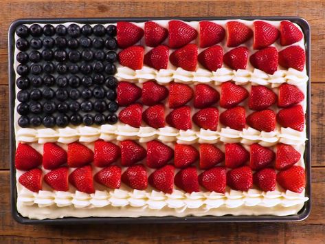 Sour Cream Flag Cake Recipe | Although this oh-so-patriotic flag cake makes an eye-catching centerpiece for your July 4th celebrations, we think this sweet sheet cake recipe makes sense all summer long. With a moist sour cream cake base, a thick vanilla-sour cream frosting, and plenty of fresh, seasonal berries, you'll be hard pressed to find a guest who won't ask for a second piece of this delicious dessert. And, of course, the presentation is incredibly charming. Flag Cake Recipe, Sour Cream Frosting, Fourth Of July Cakes, Flag Cake, Patriotic Desserts, 4th Of July Cake, Sour Cream Cake, 4th Of July Desserts, Sheet Cake Recipes