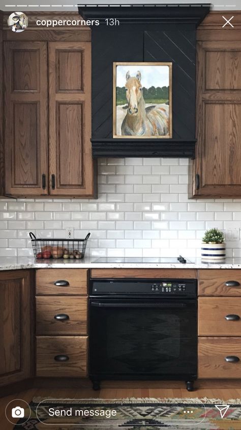 Black Kitchen Range Hood, Two Tone Wood Cabinets Kitchen, Black Hood Cover Kitchen, Black Wood Range Hood, Black Hood With Wood Trim, Black Kitchen Hood With Wood Trim, Black Hood Vents Kitchen, Black Vent Hood Wood Cabinets, Black Appliances Kitchen Wood Cabinets