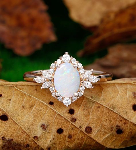 Engagement Ring Metal Type: 925 Sterling Silver, Soild 10k Gold, Solid 14k Gold, Solid 18k Gold Center Stone: Lab Created Opal Center Carat Weight: Oval Cut 1.5CT (6x8mm) Side Stone: Simulated Diamond / Moissanite Side Carat Weight: 0.44ctw Band Width: 2mm SKU: ESAMXR0005-opal Accessories: *Shipped with beautiful ring box; *Directly price from Manufacturer, 1/3 the price from Jewelry Store; - Ethically Sourced Wedding Rings With Opal, Opal Vintage Engagement Ring, Plus Size Engagement Rings, Boho Wedding Ring Set, Rings Engagement Opal, Opal And Diamond Engagement Rings, Unique Engagement Rings Silver, Opal Engagement Ring Silver, Wedding Rings Opal