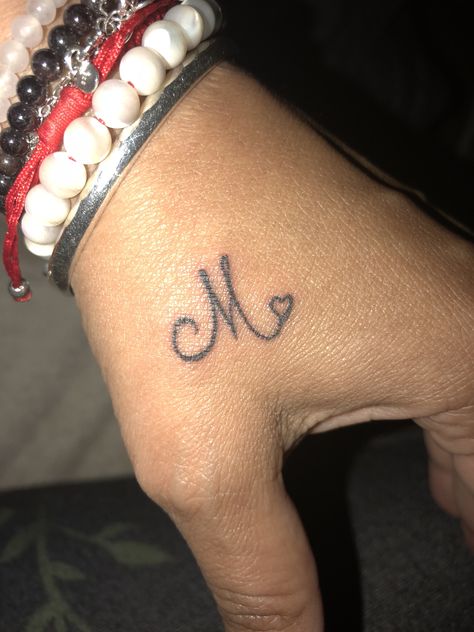 “M” my husband first name initial and a heart. Small and simple. M❤️ M Tattoo Letter Initial With Heart, Initials Tattoo Men, Tattoos With Initials In Them, Love Initials Tattoo, M Initial Tattoo Heart, Tattoo Name Initials, Cute Small Name Tattoos, M Heart Tattoo, Boyfriend Tattoo Ideas Names Initials