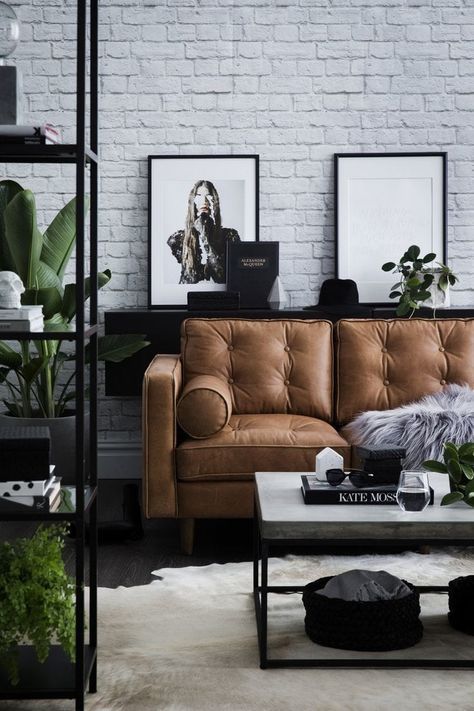 modern industrial living room with tan leather sofa and concrete coffee table Industrial Chic Interior, Sofa Kulit, Cafe Industrial, Modern Industrial Living Room, Urban Industrial Decor, Living Room Industrial, Tan Leather Sofas, Industrial Cafe, Furnitur Ruang Keluarga