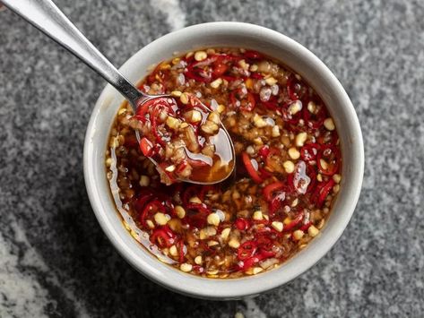 A sweet, spicy, & savory accompaniment for grilled meats. No-cook. 10 to 12 finely minced red Thai bird chilies, 1 Tbsp finely minced garlic, ¼ cup fish sauce, ½ cup light brown sugar, 3 Tbsp white vinegar, 2 Tbsp fresh lime juice. Combine all ingredients in a small jar. Shake well, set aside, & allow sugar to dissolve, shaking every 10 minutes or so. Refrigerate until ready to use. Will keep in the refrigerator for up to 3 weeks. #Asian Thai Sweet Chili Sauce Recipe, Thai Bird Chili, Chili Dipping Sauce, Thai Dipping Sauce, Sweet Chili Sauce Recipe, Asian Fish, Sweet Chili Dipping Sauce, Easy Dipping Sauce, Chili Sauce Recipe