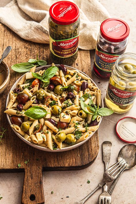 This Penne Pasta Salad with Olives is the perfect way to complete your next feast! The recipe is easy to make, requires minimal cooking and it comes together so quick thanks to Mezzetta products! Gluten-free pasta is tossed with Mezetta’s pitted greek kalamata olives, castelvetrano olives and capers. Kalamata and Castelvetranos olives make truly the best combination! | NattEats #Mezzetta #MezzettaMakesItBetta #olivepastasalad Penne Pasta Salad, Green Olive Salad, Penne Pasta Salads, Salad With Olives, Pasta With Olives, Castelvetrano Olives, Olives Kalamata, Penne Pasta Recipes, Mediterranean Meals