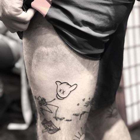 Mickey Mouse hand tattoo on the left thigh. Mickey Mouse Hands Tattoo, Mickey Mouse Tattoo For Men, Mickey Hands Tattoo, Dragon Thigh Tattoo, Thigh Tattoo Quotes, Mickey Tattoo, Thigh Tattoo Men, Mickey Mouse Tattoo, Best Leg Tattoos