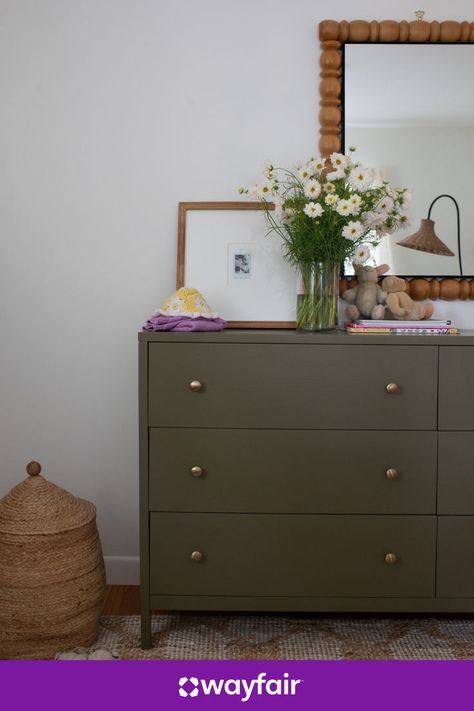 We're taking notes from this nursery. Add a glass vase, a woven hamper, and a double dresser for a space that you (and your little one) will love. Nursery Room Ideas, Simple Dresser, Woven Hamper, Nursery Organization, Hook Rack, Nursery Baby Room, Taking Notes, Double Dresser, New House Plans