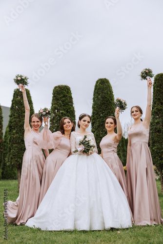 Stock Image: Group portrait of the bride and bridesmaids. Bride in a wedding dress and bridesmaids in pink or powder dresses and holding stylish bouquets on the wedding day. Bridesmaid Photo Ideas, Bridesmaids In Pink, Before Wedding Pictures, Group Portrait, Bored Board, Bride And Bridesmaids, Photos Poses, Two Brides, Wedding Picture Poses