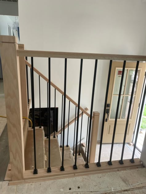 Wall Between Living And Dining Room, Railing In Living Room, Railing Between Kitchen And Family Room, Split Level Open Staircase Ideas, Diy Stair Banister Makeover, Bilevel Staircase Ideas, Split Level Stair Railing, Half Wall Staircase Railings, Split Level Railing