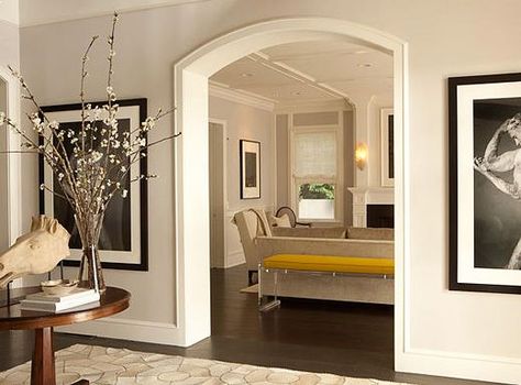 doorway in the foyer leads into the home's luxe living room. (above Archways In Homes, Door Frame Molding, Arched Doorways, Open Kitchen And Living Room, Arch Doorway, Traditional Interior Design, Classic Architecture, Arch Design, Crown Molding