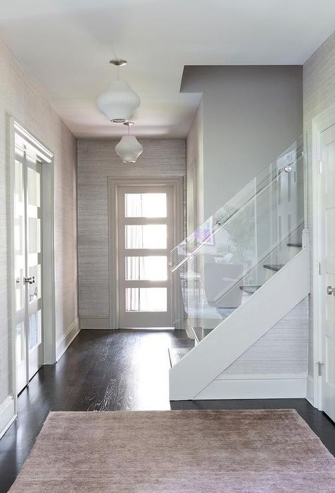 Acrylic staircase railing Wallpaper Hallways, White Wood Walls, Dark Oak Wood Floors, Grey Grasscloth Wallpaper, White Wood Wallpaper, Glass Staircase Railing, White Wood Wall, Wood Walls, Glass Staircase