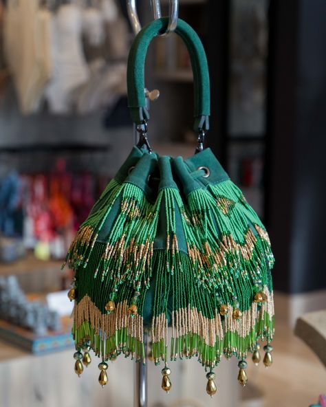 Made by an incredible Mexican designer. This elegant purse is a masterpiece that gives us the perfect mix between the different shades of green with some golden details. Elevate your outfit with it and shine even brighter!✨✨✨⁠ ⁠ Visit our Montage boutique to shop this incredible bag and more! Diy Pouches, Elegant Purse, Mexico Fashion, Hand Beaded Bag, Clothing Wishlist, Pouch Diy, Potli Bag, Potli Bags, Mexican Designs