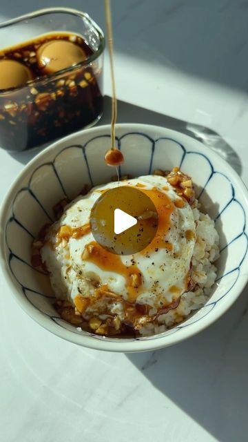 Seonkyoung Longest on Instagram: "Ganjang Gyeranbap, Korean Soy Egg Rice 🍚🍳 What to do with leftover marinade or banchan sauces?? Depending on who you ask Ganjang Gyeranbap recipe can be different but warm rice and fried egg are the main ingredients. On top of warm rice, you can choose your fat elements: Sesame oil, wild sesame oil, butter, or margarine are the most commonly used. Then you choose what kind of soy sauce you will add on top: From regular soy sauce to marinade sauce or any of the leftover sauces from banchan you have in the fridge. My childhood ganjang gyeranbap is made with butter or margarine and soy sauce. But when we have jangjorim(Soy braised meat banchan) in the fridge, that's the sauce I went for cuz it’s the BEST!! So if you make mayak eggs, soy garlic egg ( Mayak Eggs, Soy Egg, Braised Meat, Soy Eggs, Egg Rice, Seonkyoung Longest, Marinade Sauce, The Sauce, Sesame Oil