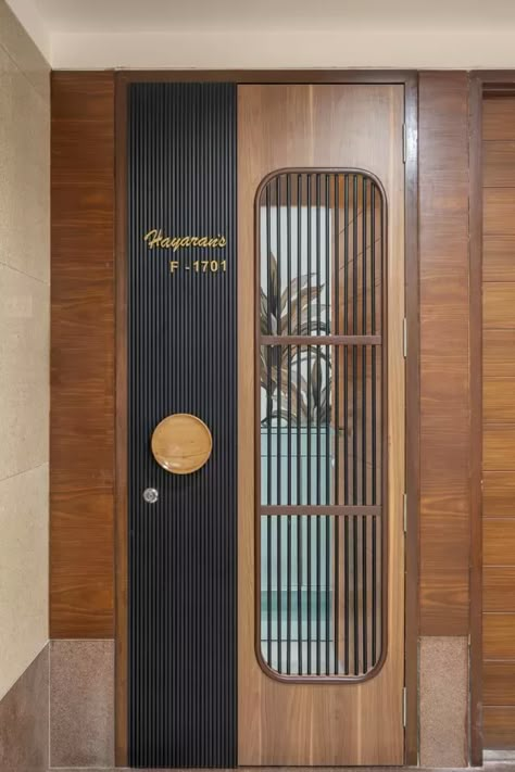 A Space for a Nuclear Family has Calm Hues, Tropical Patterns and Prints Giving a Charming View Wooden Main Door Design Wooden Main Door Design Entrance Modern, Apartment Entrance Design Front Entry, Jaali Door Design Wooden, Jaali Door Design, Safety Door Design, Security Door Design, Safety Doors, Main Door Designs, Entry Door Designs