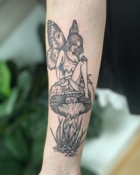 Fairy On Toadstool Tattoo, Fairy Sitting On Flower Tattoo, Forest Fairy Tattoo Sleeve, Fairy Tattoo Forearm, Fairy On A Mushroom Tattoo, Fairy Garden Tattoo Ideas, Fairy Forest Tattoo, Mushroom Garden Tattoo, Fairy On Mushroom Tattoo