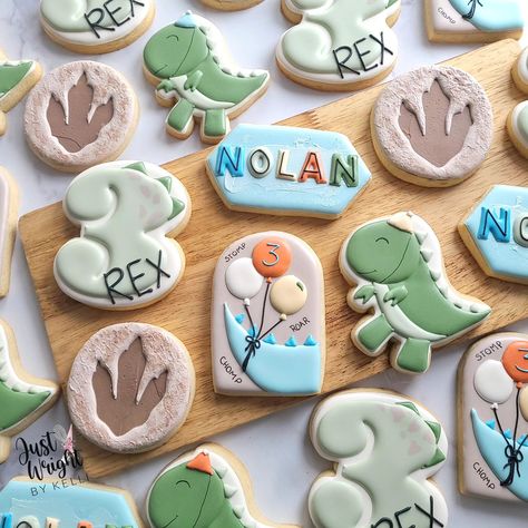 Stomp, Chomp, Roar! 🦖 Nolan's a THREE-REX and ready to party like a dinosaur with his playful birthday cookies. Happy Birthday Buddy. #threerex #birthdaysugarcookies #decoratedsugarcookies #t-rex #birthdaytreats #royalicingcookies #sugarcookiesofnstagram #balloons #dinoprint #letsparty #stompchomproar #southernNH First Birthday Dinosaur, Dino Cookies, Dinasour Birthday, Dinosaur Cookie, Dinosaur Birthday Theme, Dinosaur Birthday Party Decorations, Royal Iced Cookies, Dinosaur Cookies, Boys First Birthday Party Ideas