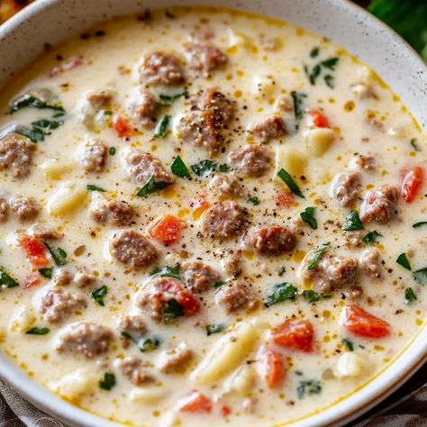 Indulge in this creamy, rich Parmesan Italian sausage soup with spinach. Perfect for any occasion. Easy to make in under 45 minutes! Creamy Parmesan Sausage Italian Soup, Slow Cooker Creamy Soup, Crockpot Italian Sausage Soup, Italian Sausage Crockpot Recipes, Creamy Parmesan Italian Sausage Soup, Italian Sausage Soup Recipes, Creamy Sausage Soup, Crockpot Cheeseburger Soup, Crockpot Cheeseburger