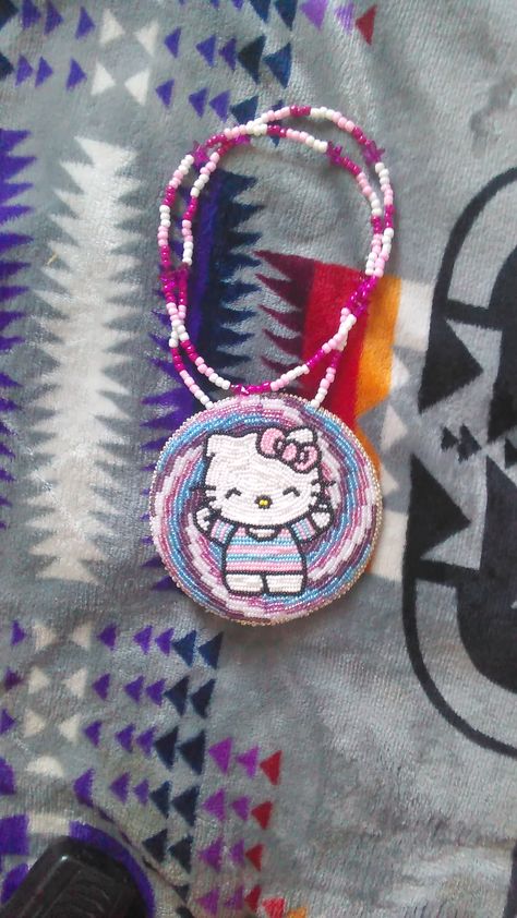 Hello Kitty medallion I made for my daughter's 6th birthday gift. First time doing beadwork. Native American Hello Kitty, Bead Loom Patterns Hello Kitty, Native Hello Kitty, American Hello Kitty, Caribou Tufting, Powwow Beadwork, Indigenous Beadwork, Hello Kitty Necklace, Beaded Medallion