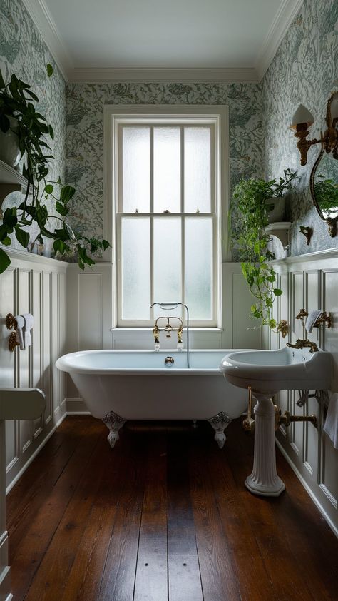 Discover tranquility in this elegant bathroom featuring a vintage clawfoot tub, floral wallpaper, and lush greenery. Perfect for relaxation and rejuvenation. #BathroomDesign #HomeDecor #VintageStyle Tiny Bathroom Clawfoot Tub, Small Bathroom Clawfoot Tub, Clawfoot Tub Bathroom Farmhouse Style, Clawfoot Tub Bathroom Vintage, Clawfoot Tub Shower Combo, Bathrooms With Clawfoot Tubs, Clawfoot Tub Ideas, Bathroom With Clawfoot Tub, Clawfoot Tub Bathroom