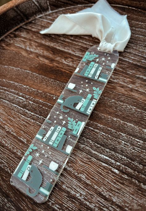 Bookmark details: ✔️1 acrylic bookmark with vinyl design.  ✔️Design is made with high quality, permanent adhesive vinyl & sealed with clear resin ✔️Chiffon ribbon is included in purchase.  ✔️Bookmark measures approximately 5.5" x 1.25". All items are made to order so shipping times may vary. Thank you! Clear Acrylic Bookmarks, Diy Acrylic Bookmarks Cricut, Diy Resin Bookmarks, Diy Acrylic Bookmark, Acrylic Bookmarks Diy, Acrylic Book Marks, Acrylic Bookmarks Cricut, Cricut Bookmark Ideas, Resin Bookmark Ideas