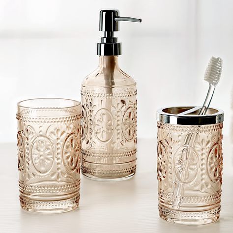 PRICES MAY VARY. Glass, Metal, Plastic The timeless charm and classic elegance of this Bath Collection makes it a perfect addition to your vintage inspired bathroom. Charming and elegant floral and beading design in romantic tinted blush pink Lotion Bottle is made of embossed tinted glass with plastic pump. Dimensions: 2.70" x 2.70" x 8.20". Holds up to 10.00 oz. of liquid soap or lotion. Toothbrush Holder is made of embossed tinted glass with metal top. Dimensions: 2.70" x 2.70" x 4.60". 2 open Floral Hedge, Vintage Inspired Bathroom, Glass Bathroom Accessories, Bathroom Tumbler, Spa Decor, Bathroom Toothbrush Holder, Classic Bathroom, Tinted Glass, Bath Accessories Set