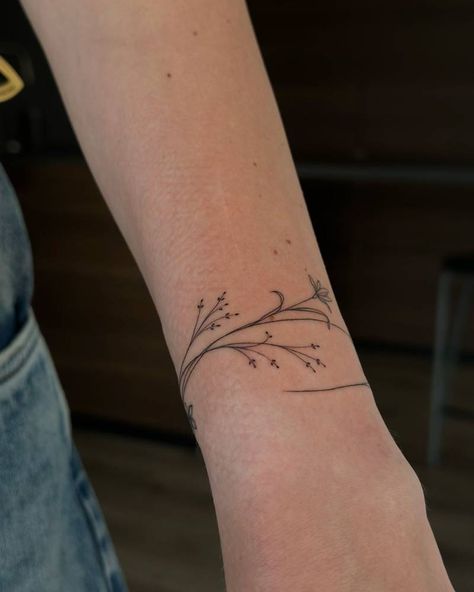 Delicate Flower Wrist Tattoo, Fine Line Ankle Bracelet Tattoo, Fine Line Tattoo Arm Women, Fine Line Tattoo Bracelet, Wrist Fine Line Tattoo, Flower Wrist Wrap Tattoo, Fine Line Tattoo Wrist, Flower Arm Band Tattoo, Wrist Wrap Tattoos For Women