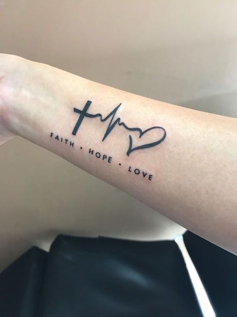 180+ Best Faith Tattoos Designs With Meaning (2023) - TattoosBoyGirl Ecg Tattoo, Faith Tattoo Designs, Heartbeat Tattoo Design, Faith Hope Love Tattoo, Wörter Tattoos, Faith Tattoo On Wrist, Hope Tattoo, Heartbeat Tattoo, Meaningful Tattoo Quotes