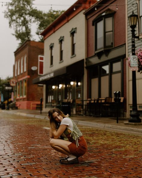 Come rain or come shine . . . . 📸 @amandaashleyphotography 🪡👚: @fatboyjeanne_ #model #photography #rain #brickroad #photoshoot #quilted #downtown #fashion Fall City Senior Pictures, Fall Aesthetic Photoshoot Ideas, Person Standing In Rain, Picture Poses Downtown, Senior Picture Ideas Small Town, Small Town Photoshoot Ideas, Senior Pictures In The Rain, Downtown Photoshoot Poses, Fall City Photoshoot