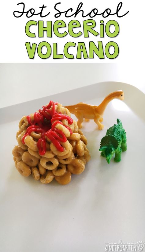 These yummy Cheerio volcano snacks are perfect for a dinosaur theme in tot school, preschool, or kindergarten! Volcano Snacks Preschool, Fossil Themed Snacks, Dinosaur Food Craft, Volcano Themed Snacks, Dinosaur Food Activities, Volcano Themed Food, Dinosaur Cooking Activities Preschool, Volcano Snacks For Kids, Volcano Snacks