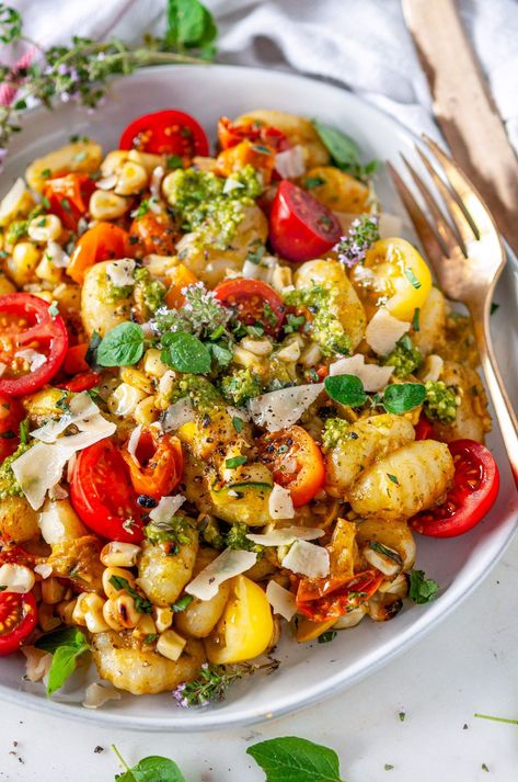 Got leftover corn from the grill? Or maybe a surplus of cherry tomatoes from the garden? Try this summer harvest skillet gnocchi recipe! Packed with fresh vegetables and herbs, this quick and easy potato pasta dish is bursting with summertime flavor. Plus, it only takes 30 minutes to make! Corn Gnocchi, Summer Gnocchi, Pesto Corn, Harvest Skillet, Skillet Gnocchi, Leftover Corn, Gnocchi Recipes Homemade, Summer Pasta Dishes, How To Cook Gnocchi